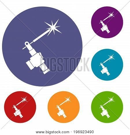 Mig welding torch in hand icons set in flat circle red, blue and green color for web