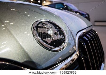 BERLIN - MAY 02 2015: Showroom. The emblem of large family car Skoda Superb (Third generation). Produced since 2015.