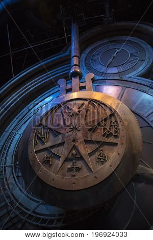 LEAVESDEN UK - JUNE 19TH 2017: The swinging clock tower pendulum prop on display at the Making of Harry Potter Studio Tour at the Warner Bros. Studios in Leavesden UK on 19th June 2017.