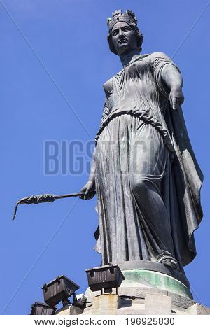 The magnificent statue ontop of the Column of the Goddess situated in Grand Place - the central square in the historic city of Lille in France.