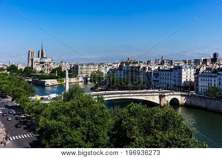 Panorama of Paris: Cité Island with Notre Dame de Paris Cathedral and Saint Louis Island on the Seine river. Notre Dame cathedral is a medieval catholic cathedral and finest example of french gothic architecture. France.