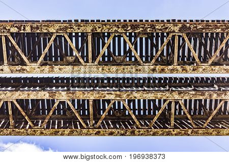 Isolated railroad old bridge against sky in Accotink park