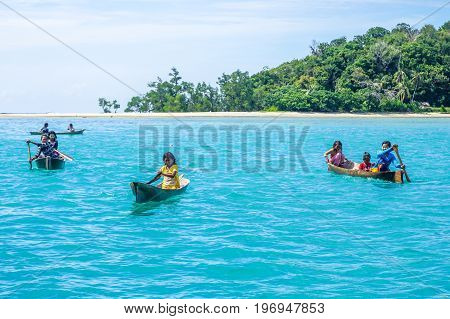 Semporna,Sabah,Malaysia-Apr 23,2017:Sea Gypsy kids on unique handmade boats with clear water on at Bodgaya island,Semporna,Sabah,Malaysia.