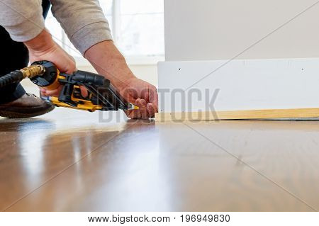 Gauge Finish Nailer Man Nailed Slats Custom House Molding Contractor Up A Wall Section For Luxury