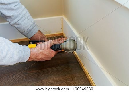 Gauge Finish Nailer Man Nailed Slats Custom House Molding Contractor Up A Wall Section For Luxury