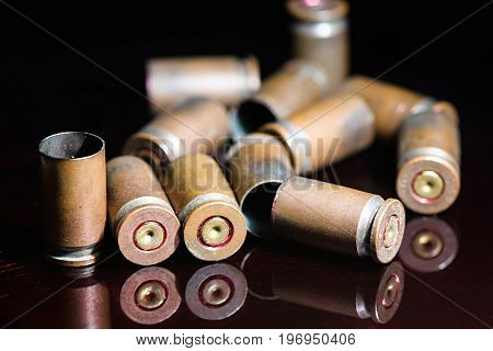 Beautifully grouped with empty shells of 9 mm pistol close up