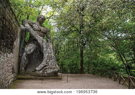Bomarzo, Italy - May 20, 2013. View of sculpture amidst the vegetation in the Park of Bomarzo. Also known as Park of Monsters, it was created to surprise the visitor with surrealistic works in stone. Lazio region, central Italy