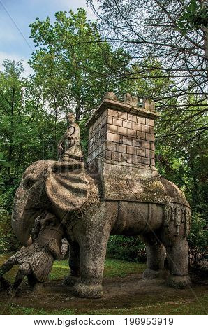 Bomarzo, Italy - May 20, 2013. View of sculpture amidst the vegetation in the Park of Bomarzo. Also known as Park of Monsters, it was created to surprise the visitor with surrealistic works in stone. Lazio region, central Italy
