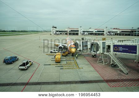 BANGKOK, THAILAND 21 JULY 2017. NOKAIR airline loading cargo on the plane at the gate in Don Mueang international airport (DMK)