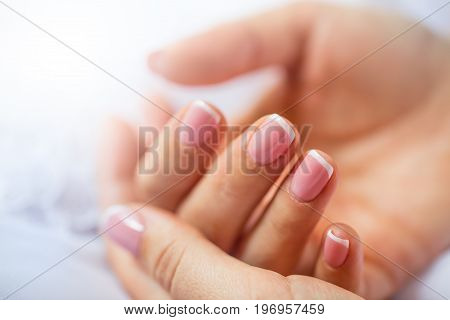 Nails. Beautiful female hand with colorful nail design manicure.