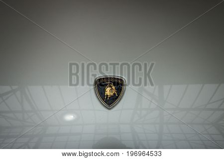 BERLIN - MAY 10 2015: The logo on the hood of a mid-engined supercar Lamborghini Countach LP 25th Anniversary 1990. Black and white. 28th Berlin-Brandenburg Oldtimer Day