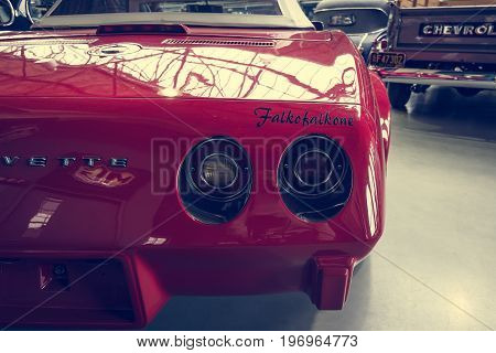 BERLIN - MAY 10 2015: The rear stoplight of a sports car Chevrolet Corvette (C3) Stingray Convertible. Stylization. Vintage toning. 28th Berlin-Brandenburg Oldtimer Day