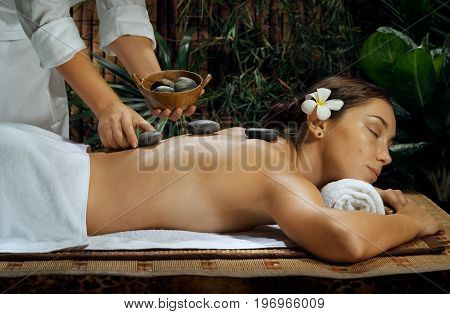 portrait of young beautiful woman in spa environment