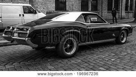 BERLIN - MAY 10 2015: Personal luxury car Buick Riviera GS 1966. Rear view. Black and white. The 28th Berlin-Brandenburg Oldtimer Day