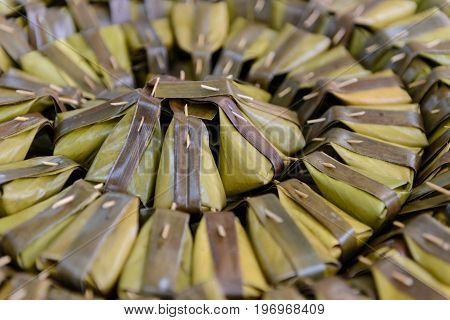 Thai Dessert. Steamed Flour With Coconut Filling (kanom Sai Sai) Packaging From Banana Leaf