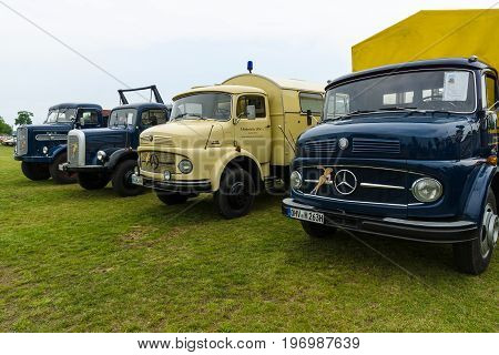 PAAREN IM GLIEN GERMANY - MAY 23 2015: Trucks Daimler-Benz L323 Mercedes-Benz LA 710 Daimler-Benz LAF 311/36 and MAN 620 L1. The oldtimer show in MAFZ.