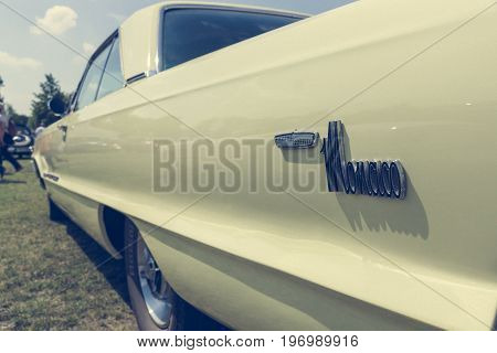 PAAREN IM GLIEN GERMANY - MAY 23 2015: Fragment of a full-size automobile Dodge Monaco. Stylization. Vintage toning. The oldtimer show in MAFZ.