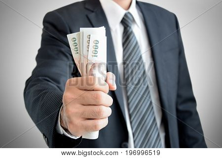 Businessman Hand Grabbing Money Thai Baht (thb)