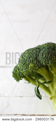 Fresh Brocoli On A White Wooden Background.