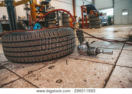 Replacing Winter Tires On Summer Tires In A Professional Garage With The Help Of Professional Tools.
