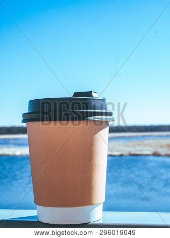 Paper Cup Of Coffee On Natural Morning Background. Film Effect.