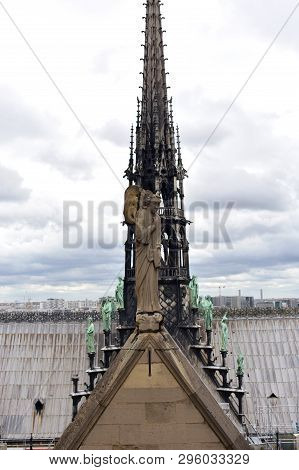 Notre Dame Spire, La Fleche, And Lead Clad Wooden Roofs Before The Fire. Angel Statue, Apostles And 