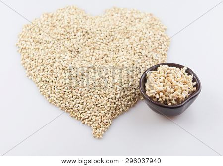 Sprouts of green buckwheat on white background. Macro shot raw organic buckwheat plant. Vegan germinated sprouts, vegetarian cuisine. Healthy diet buckwheat porridge food. 