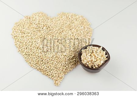 Sprouts of green buckwheat on white background. Macro shot raw organic buckwheat plant. Vegan germinated sprouts, vegetarian cuisine. Healthy diet buckwheat porridge food. 