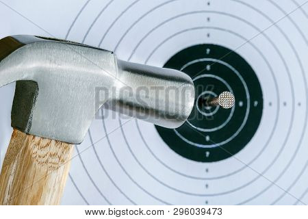 Business Success Concept. Target Hit In Center By Steel Nail.