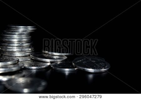 Coins On A Black Background, A Stack Of Coins,