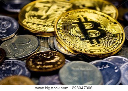 Golden Bitcoin Coins On A Black Background