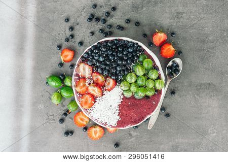 Ripe Fruit On Bowl. Strawberry, Gooseberry And Blueberry Decorated With Coconut Flakes. High Resolut