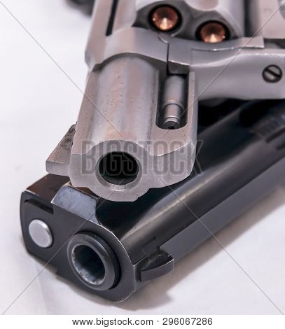 Two Handguns, A 40 Caliber Pistol And A 357 Magnum Revolver On A White Background