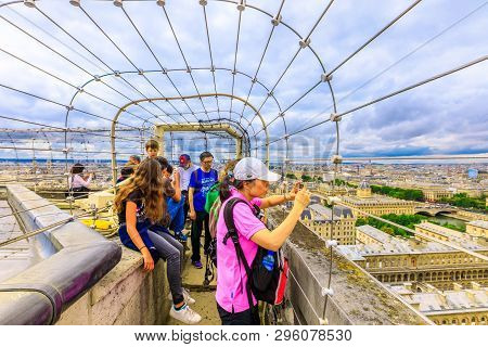 Paris, France - July 2, 2017: Top Of The Notre Dame With Tourists Taking Pictures. Aerial View On Th