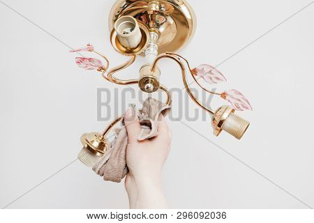 Lamp On The Ceiling Without Lamps. Girl Washes His Rag. Have Toning. Close-up