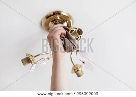 Lamp On The Ceiling Without Lamps. Girl Washes His Rag. Have Toning. Close-up