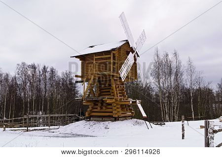 Wooden Windmill In The Village In The Winter
