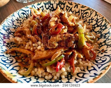 Couscous With Curry Bbq Chicken And Vegetables Served At Restaurant / Kuskus. Traditional Food.