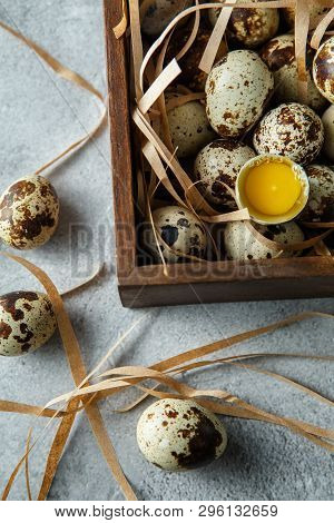 Quail Eggs. Flat Lay Composition With Small Quail Eggs In The Wooden Box On The Concrete Background.