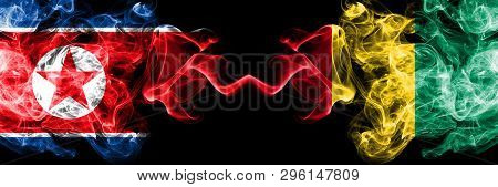 North Korea Vs Guinea, Guinean Smoky Mystic Flags Placed Side By Side. Thick Colored Silky Smoke Fla