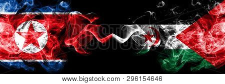 North Korea Vs Sahrawi Smoky Mystic Flags Placed Side By Side. Thick Colored Silky Smoke Flags Of No