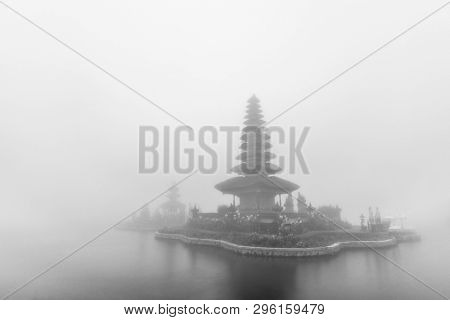Foggy weather at Pura Ulun Danu Beratan temple in Bali, Indonesia. Black and white photo.