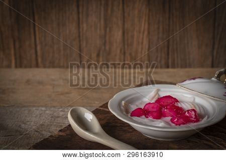 Thapthim Krop, Mock Pomegranate Seeds In Coconut And Syrup In The White Bowl On The Wood Table There