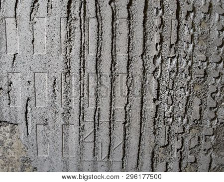 Concrete Wall With Remnants Of Glue For Ceramic Tiles. Texture