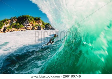 April 18, 2019. Bali, Indonesia. Surfer Ride On Barrel Wave. Professional Surfing At Big Waves In Pa