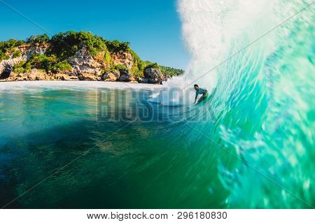 April 18, 2019. Bali, Indonesia. Surfer Ride On Barrel Wave. Professional Surfing At Big Waves In Pa