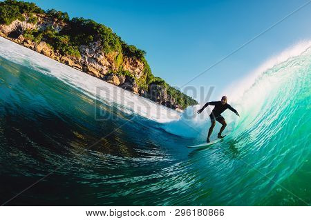 April 18, 2019. Bali, Indonesia. Surfer Ride On Barrel Wave. Professional Surfing At Big Waves In Pa