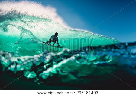 April 18, 2019. Bali, Indonesia. Surfer Ride On Barrel Wave. Professional Surfing At Big Waves In Pa