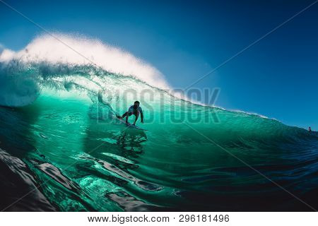 April 18, 2019. Bali, Indonesia. Surfer Ride On Barrel Wave. Professional Surfing At Big Waves In Pa