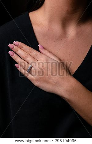 Womens Silver Diamonds Ring With A Fringe On Finger, On A Black Background.